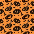 Halloween seamless pattern with pumpkins and bats on orange background Royalty Free Stock Photo